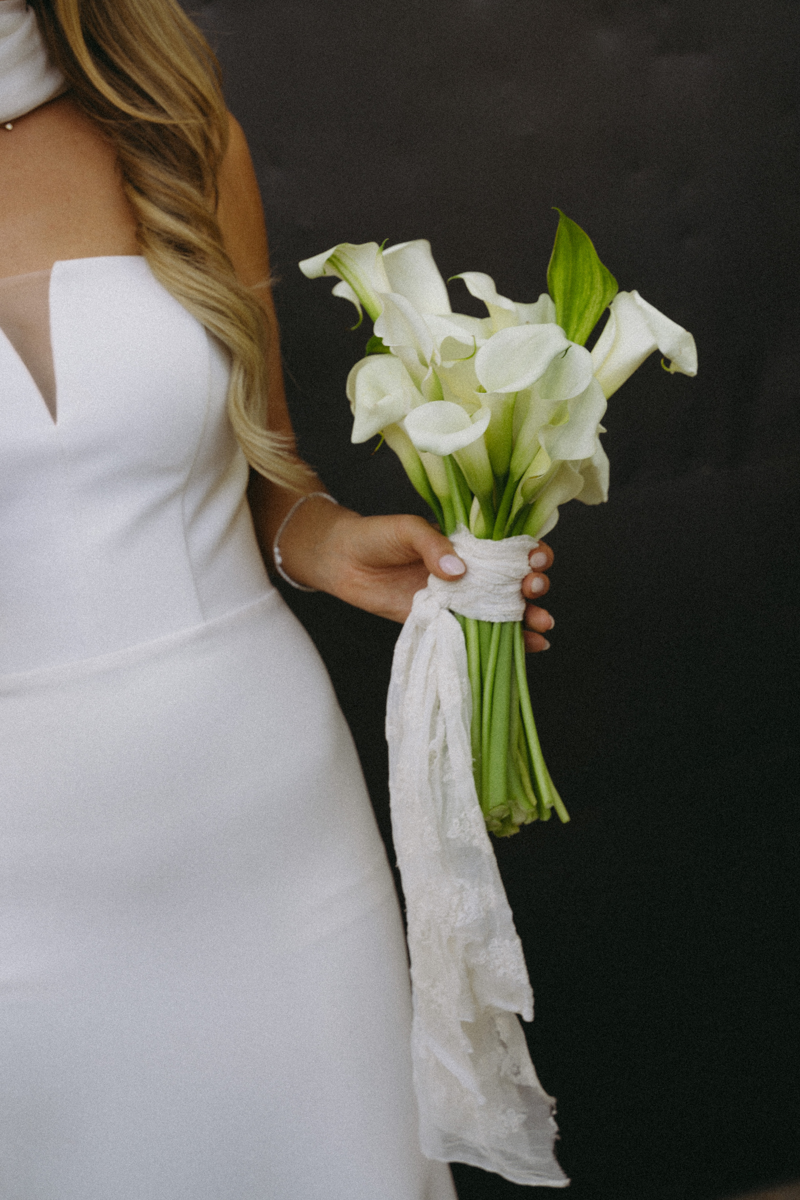 A close-up of white bridal calla lilies
