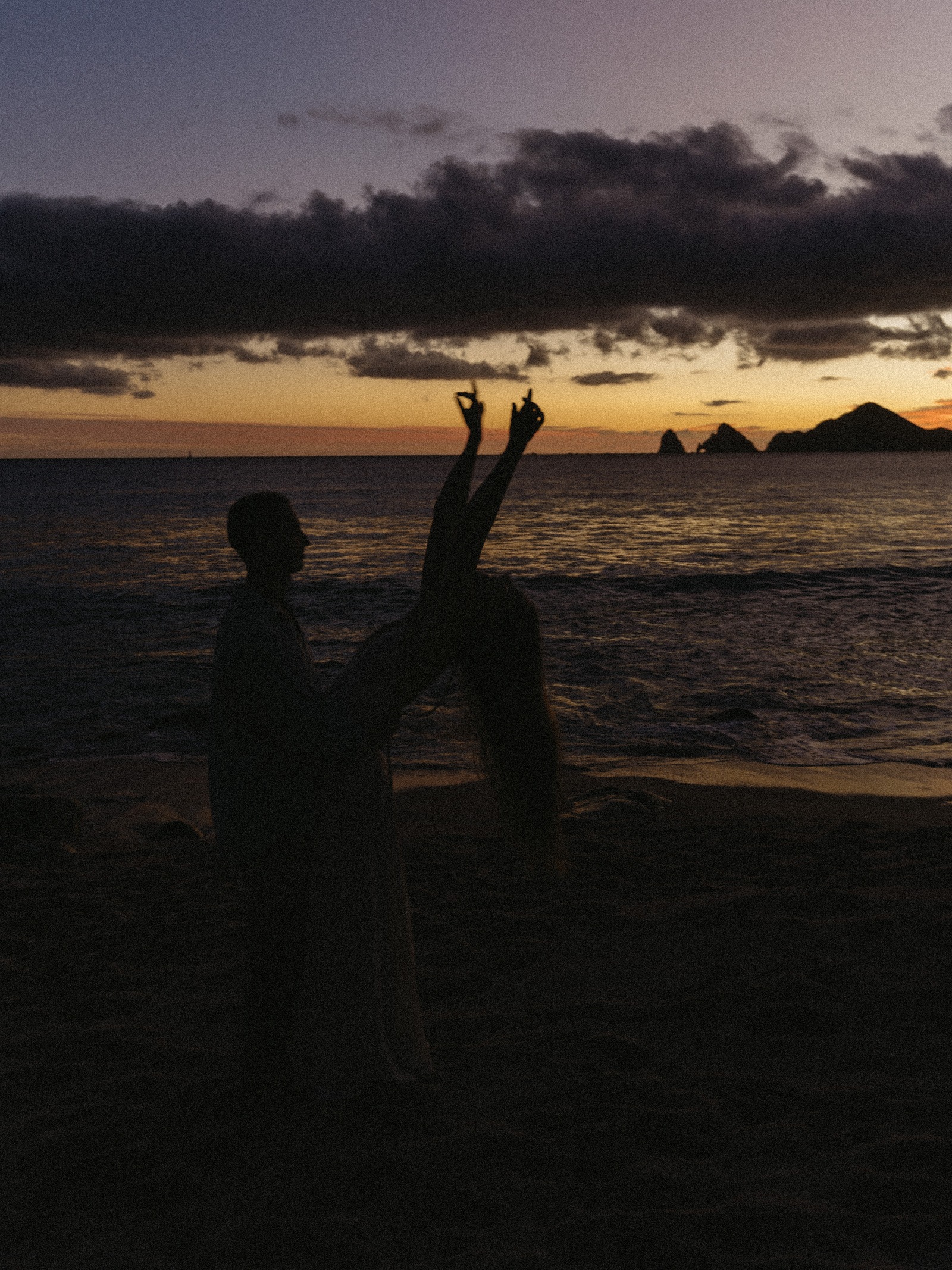 Silhouettes celebrating against the sunset