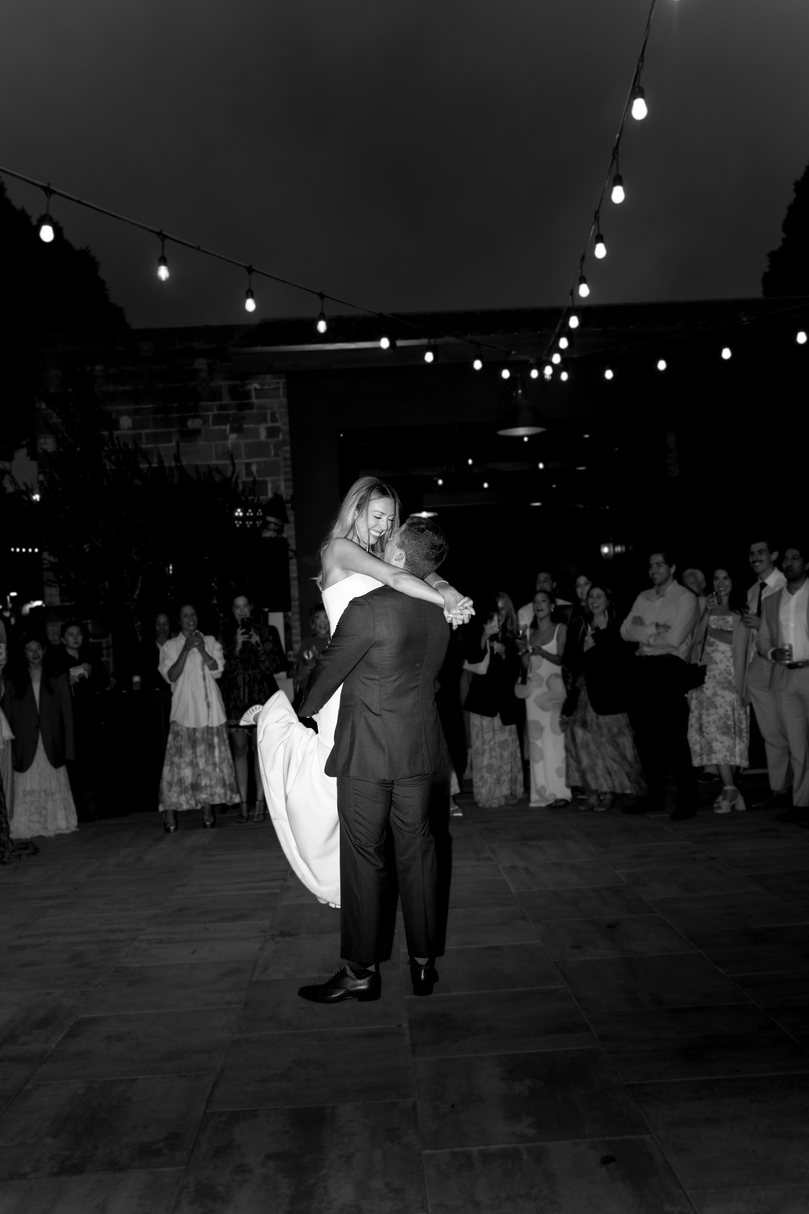 A first dance beneath the string lights