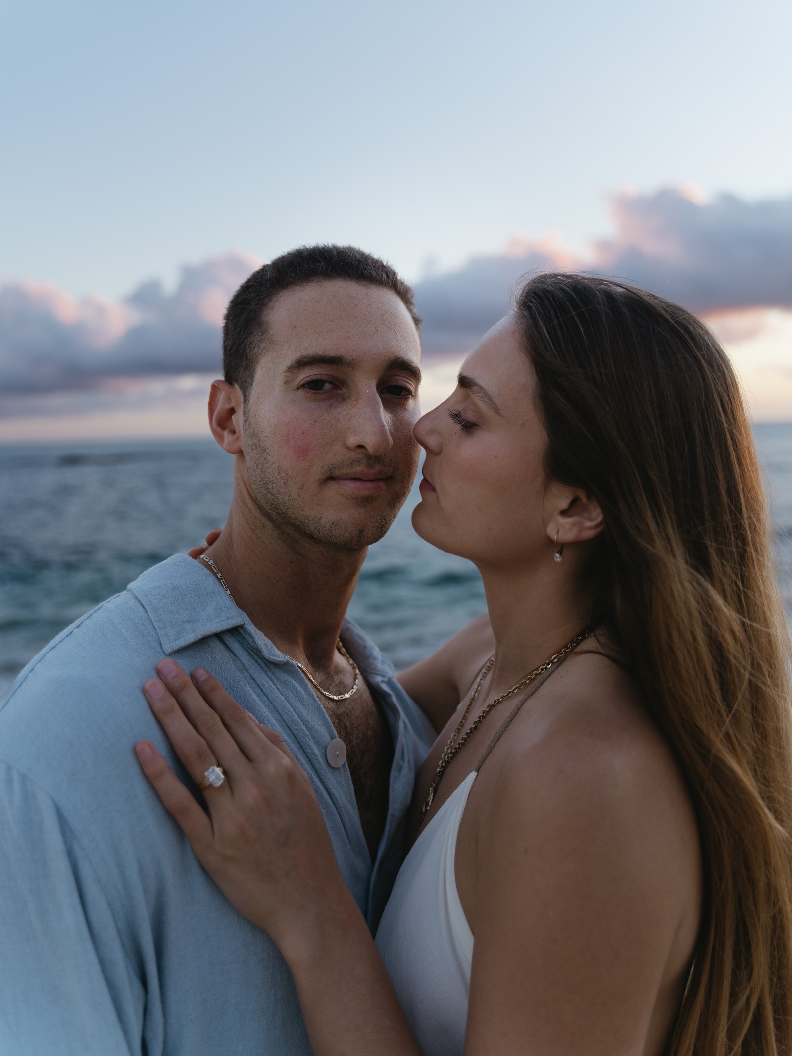 A sunset embrace beside the ocean