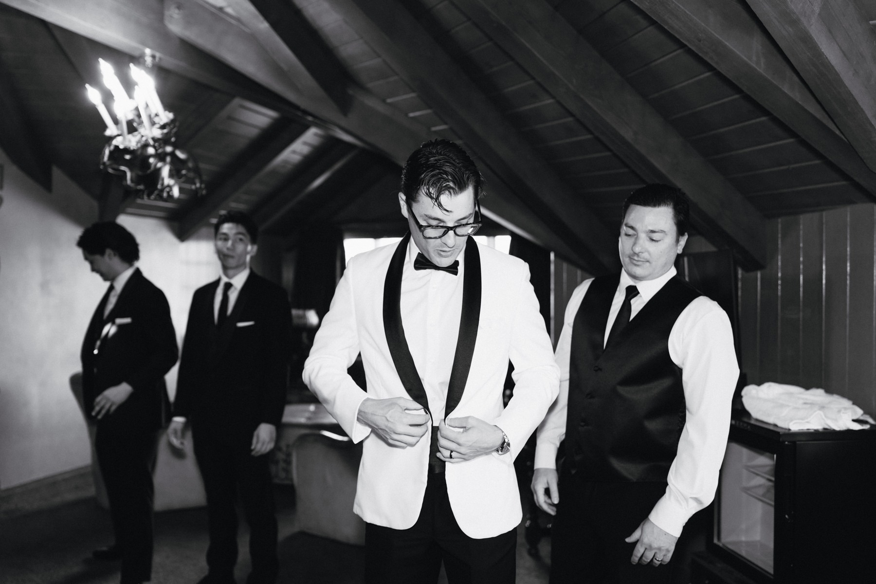 The groom getting ready with his groomsmen